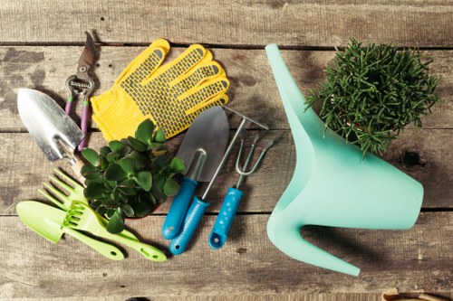 Gardener working in a Chingford front garden with tools