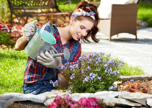 Gardener in Chingford assessing a front garden before work begins